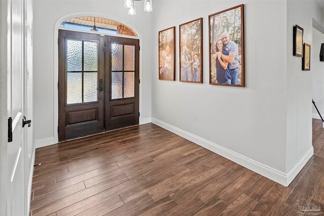 entryway featuring a chandelier, french doors, and dark hardwood / wood-style flooring