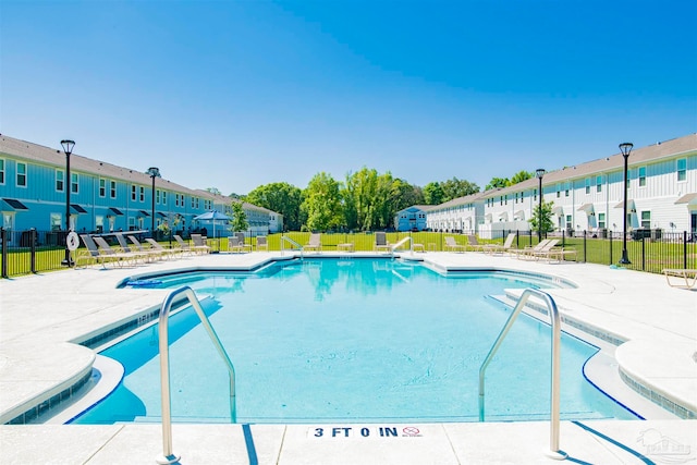 view of swimming pool with a patio