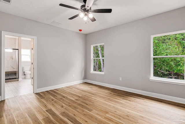 unfurnished room with light tile patterned floors and ceiling fan