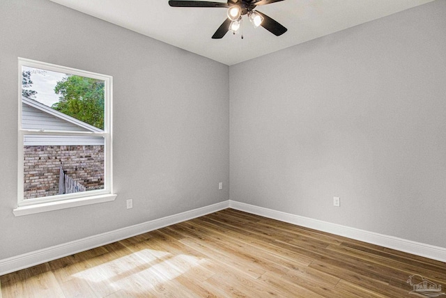 unfurnished room featuring hardwood / wood-style flooring and ceiling fan