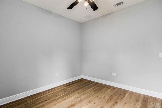 unfurnished room with ceiling fan and hardwood / wood-style floors