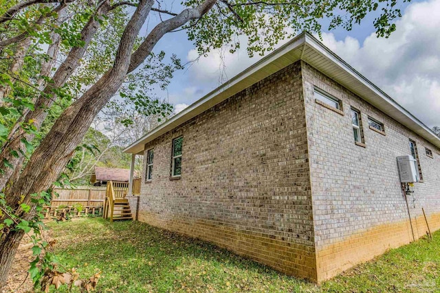 view of side of property with a wooden deck