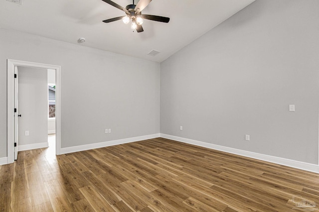 spare room with hardwood / wood-style floors and ceiling fan