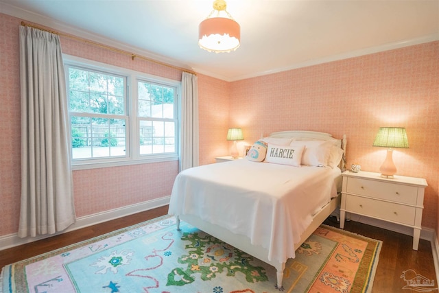 bedroom with ornamental molding and dark wood-type flooring