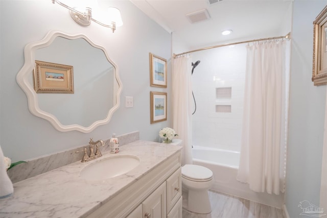 full bathroom featuring vanity, shower / tub combo, and toilet