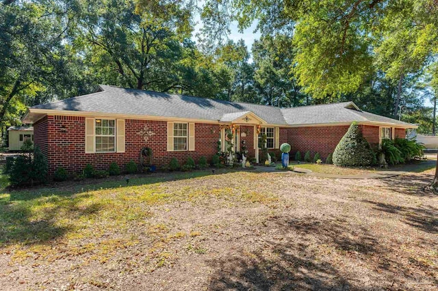 ranch-style house with a front lawn