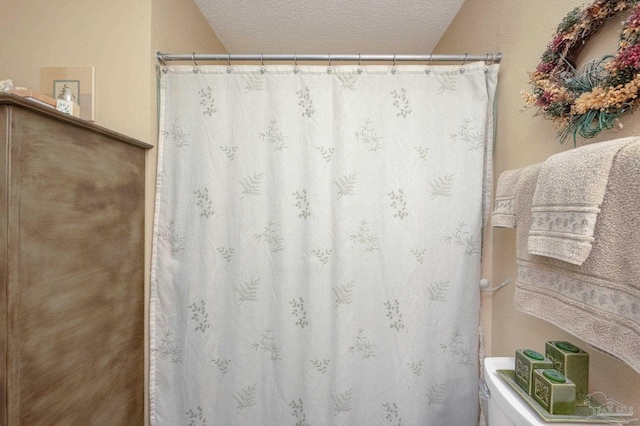 bathroom with a textured ceiling