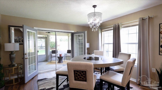 1462 Camrose Pl, Pensacola, FL 32534 - dining room featuring french doors, plenty of natural light, a chandelier, and a textured ceiling