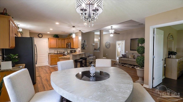 1462 Camrose Pl, Pensacola, FL 32534 - dining space with ceiling fan, wood finished floors, recessed lighting, a chandelier, and baseboards