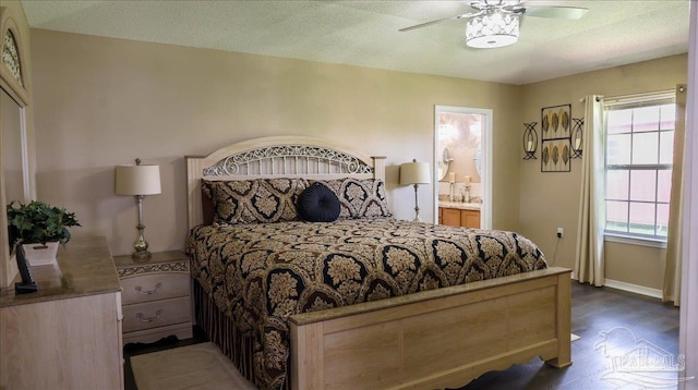1462 Camrose Pl, Pensacola, FL 32534 - bedroom featuring wood finished floors, baseboards, ensuite bathroom, and ceiling fan