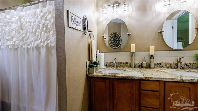 1462 Camrose Pl, Pensacola, FL 32534 - full bath featuring double vanity, tasteful backsplash, and a textured wall