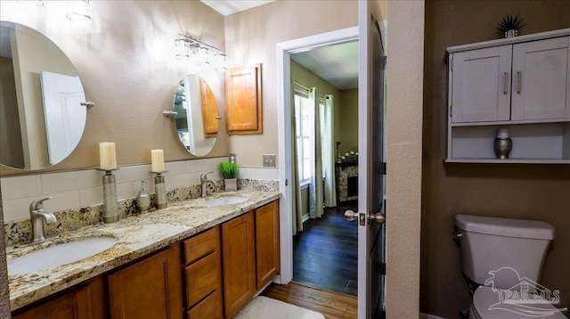 1462 Camrose Pl, Pensacola, FL 32534 - bathroom featuring toilet, wood finished floors, and double vanity