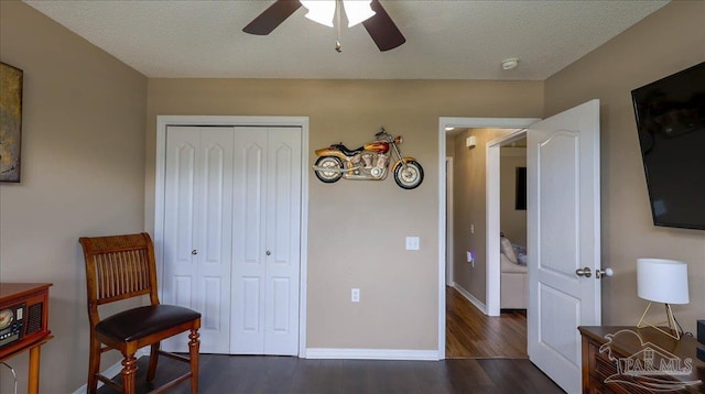 1462 Camrose Pl, Pensacola, FL 32534 - bedroom featuring dark wood-style flooring, a closet, baseboards, a ceiling fan, and a textured ceiling