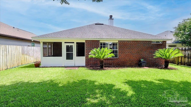 1462 Camrose Pl, Pensacola, FL 32534 - rear view of house featuring a chimney, brick siding, and a shingled roof
