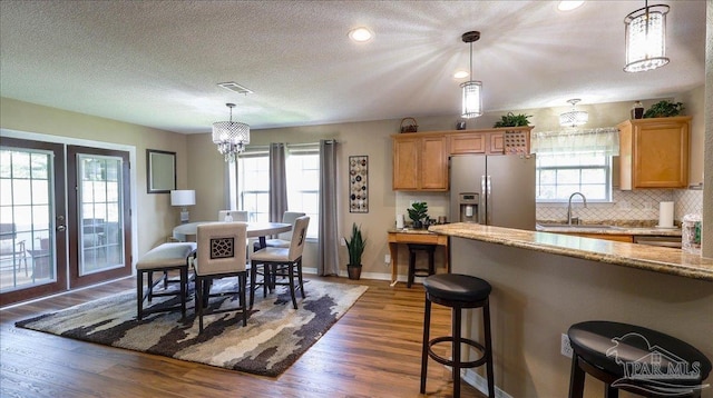 1462 Camrose Pl, Pensacola, FL 32534 - dining area featuring dark wood-type flooring, french doors, baseboards, a chandelier, and recessed lighting