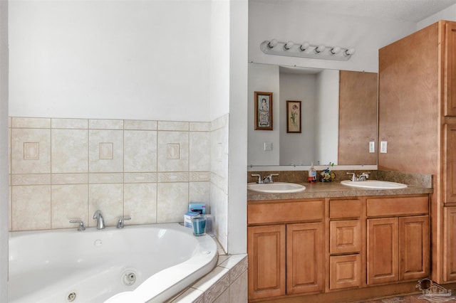 bathroom with vanity and tiled tub