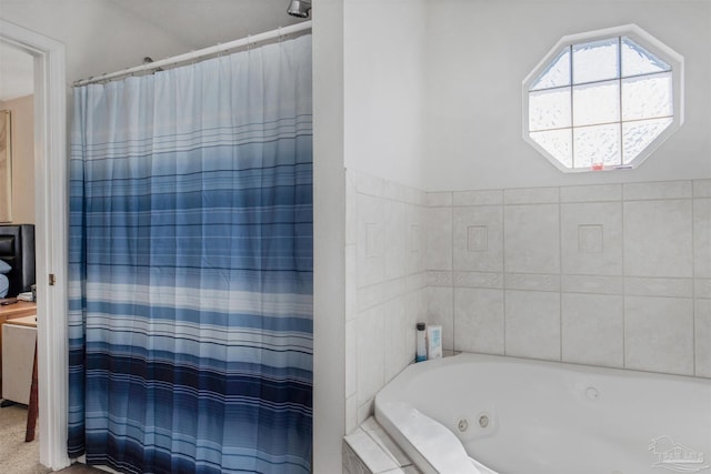 bathroom with tiled bath