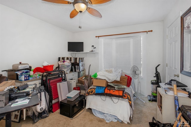 bedroom with ceiling fan and carpet flooring