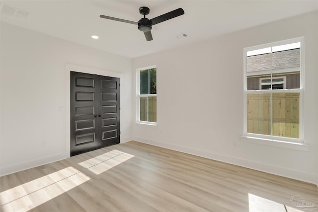 2120 W Desoto St, Pensacola, FL 32505 - empty room with wood finished floors, a ceiling fan, baseboards, and recessed lighting