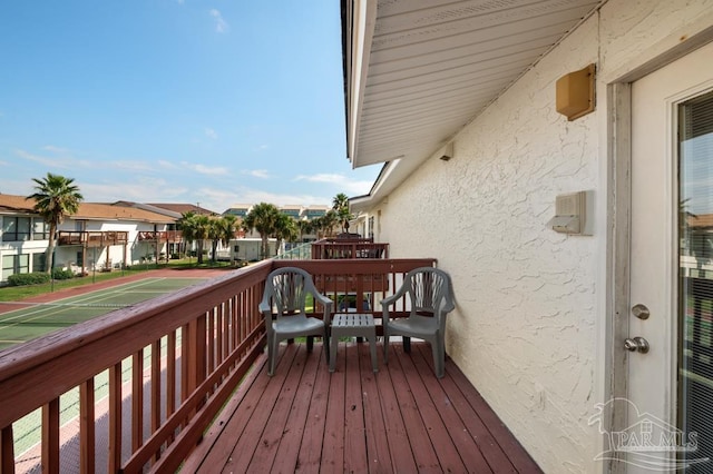 8425 Gulf Blvd Unit 206, Navarre Beach, FL 32566 - wooden deck featuring a residential view