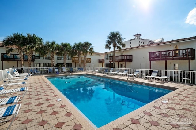 8425 Gulf Blvd Unit 206, Navarre Beach, FL 32566 - pool with fence and a patio