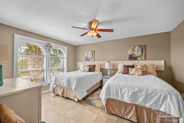 8425 Gulf Blvd Unit 206, Navarre Beach, FL 32566 - bedroom with light tile patterned floors, ceiling fan, and a textured ceiling