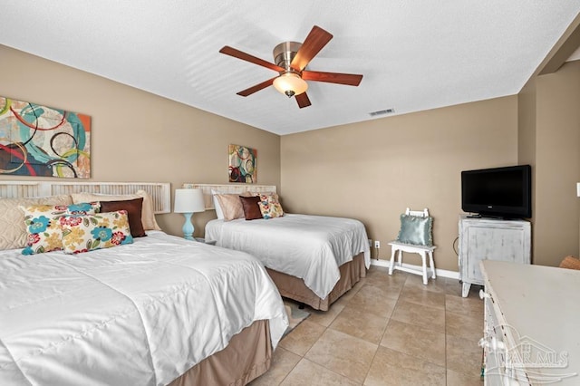 8425 Gulf Blvd Unit 206, Navarre Beach, FL 32566 - bedroom featuring ceiling fan, light tile patterned flooring, and baseboards