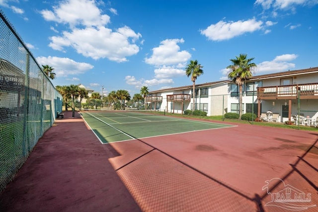 8425 Gulf Blvd Unit 206, Navarre Beach, FL 32566 - view of sport court featuring fence and a residential view