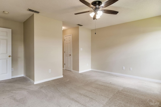 6027 Dallas Ave, Pensacola, FL 32526 - unfurnished room featuring a ceiling fan, light colored carpet, a smoke detector, and a textured ceiling