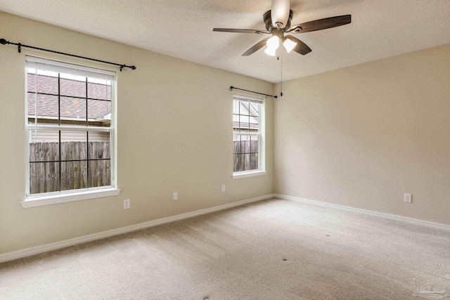 6027 Dallas Ave, Pensacola, FL 32526 - carpeted spare room with ceiling fan, a textured ceiling, and healthy amount of natural light