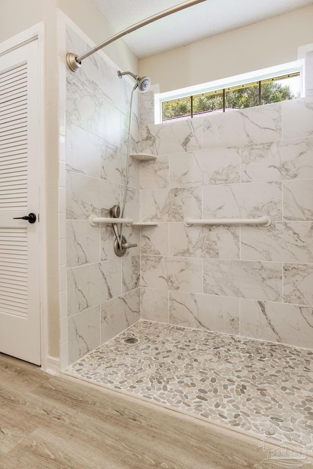 6027 Dallas Ave, Pensacola, FL 32526 - full bath with tiled shower and wood finished floors