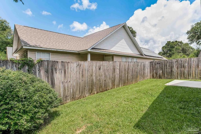 6027 Dallas Ave, Pensacola, FL 32526 - view of side of home featuring a fenced backyard and a shingled roof