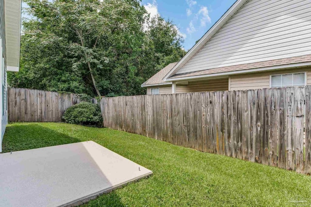 6027 Dallas Ave, Pensacola, FL 32526 - fenced backyard with a patio