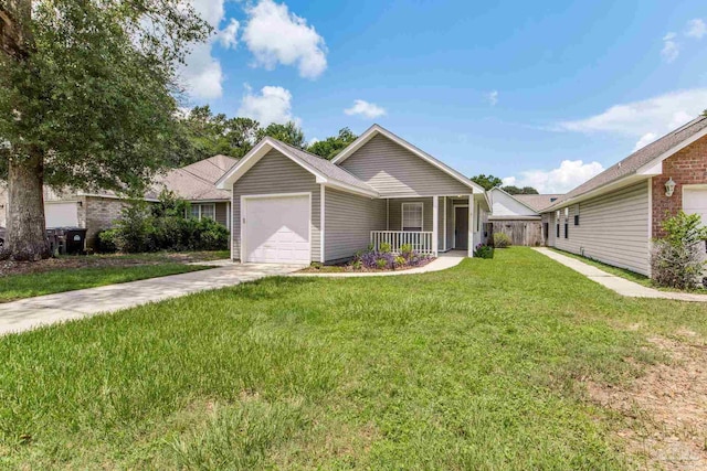6027 Dallas Ave, Pensacola, FL 32526 - ranch-style house with covered porch, an attached garage, a front lawn, and driveway