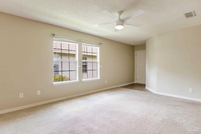 6027 Dallas Ave, Pensacola, FL 32526 - spare room with carpet, ceiling fan, and a textured ceiling