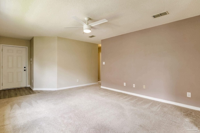 6027 Dallas Ave, Pensacola, FL 32526 - empty room with carpet flooring, ceiling fan, and a textured ceiling