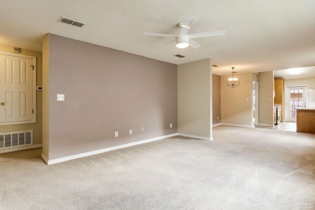 6027 Dallas Ave, Pensacola, FL 32526 - empty room with a ceiling fan, a chandelier, light colored carpet, and a textured ceiling