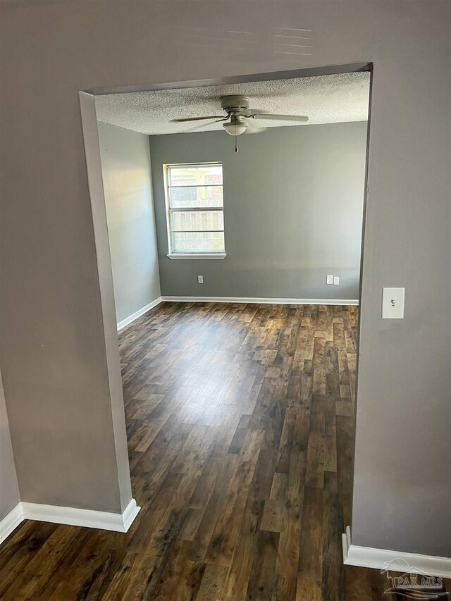 6255 Memphis Ave, Pensacola, FL 32526 - spare room with ceiling fan, wood finished floors, a textured ceiling, and baseboards