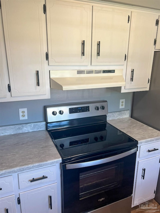 6255 Memphis Ave, Pensacola, FL 32526 - kitchen with stainless steel appliances, under cabinet range hood, light countertops, and white cabinets