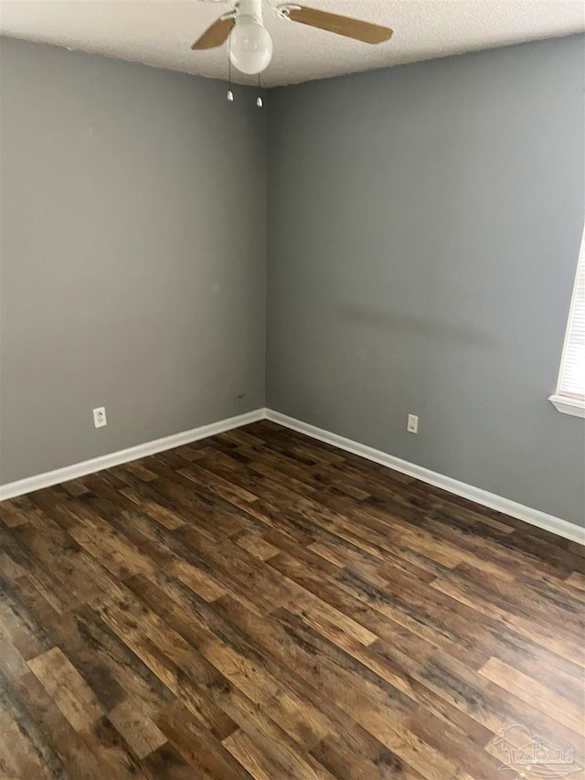 6255 Memphis Ave, Pensacola, FL 32526 - spare room with ceiling fan, dark wood finished floors, and baseboards