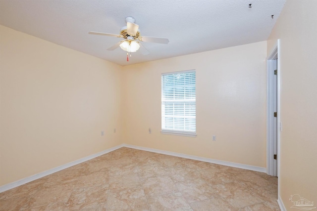 empty room featuring a textured ceiling and ceiling fan