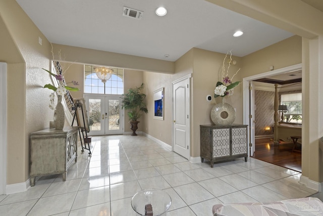 entryway with baseboards, visible vents, light tile patterned flooring, french doors, and recessed lighting