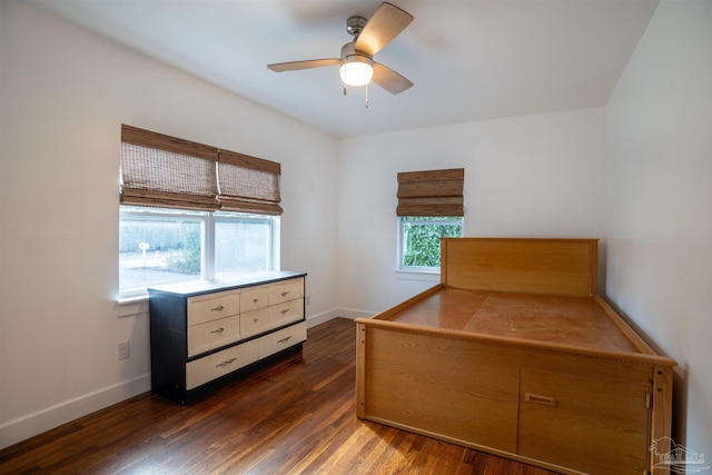 bedroom featuring ceiling fan and dark wood-type flooring