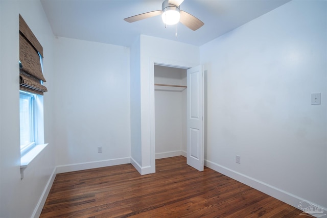 unfurnished bedroom with ceiling fan, a closet, and dark hardwood / wood-style flooring