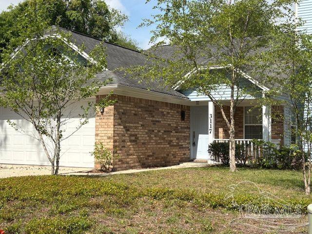 3117 Albert Ct, Pensacola, FL 32504 - exterior space with a shingled roof, an attached garage, a front lawn, brick siding, and covered porch