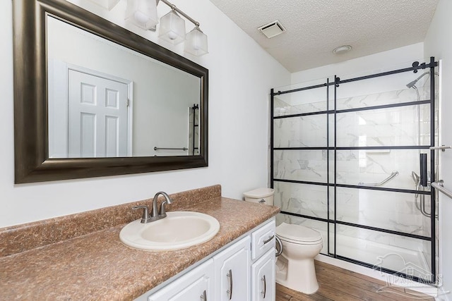 3117 Albert Ct, Pensacola, FL 32504 - bathroom featuring toilet, visible vents, a shower stall, and wood finished floors