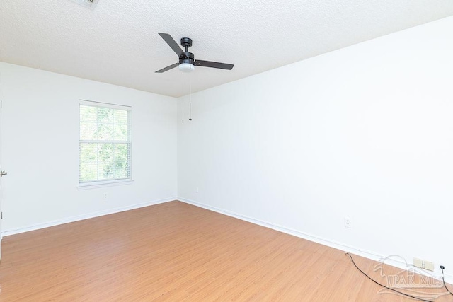 3117 Albert Ct, Pensacola, FL 32504 - empty room with baseboards, a ceiling fan, a textured ceiling, and wood finished floors