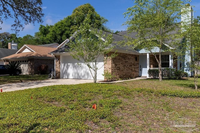 3117 Albert Ct, Pensacola, FL 32504 - view of front of house with brick siding, an attached garage, driveway, and a front yard
