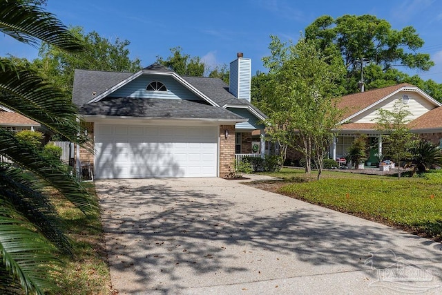 3117 Albert Ct, Pensacola, FL 32504 - view of front of house featuring a front lawn, brick siding, a garage, a chimney, and concrete driveway