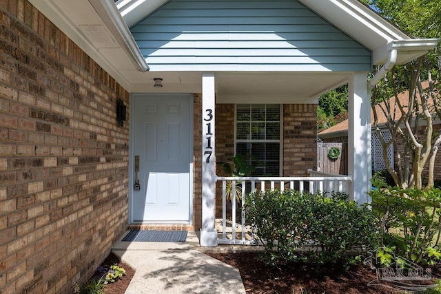 3117 Albert Ct, Pensacola, FL 32504 - doorway to property featuring a porch and brick siding
